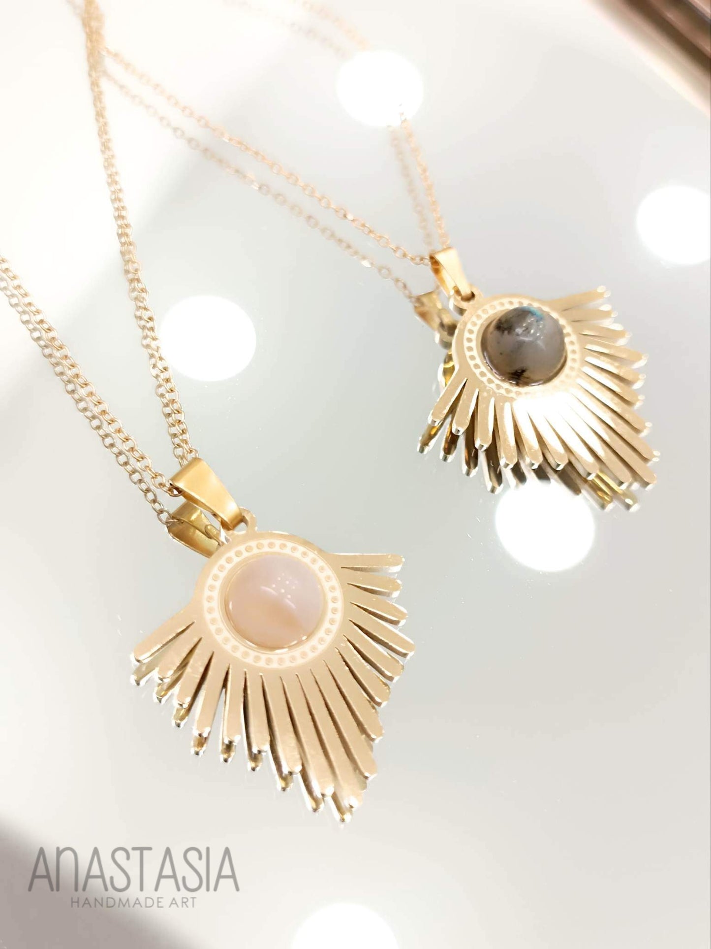 Necklace with rose quartz or moon stone charm