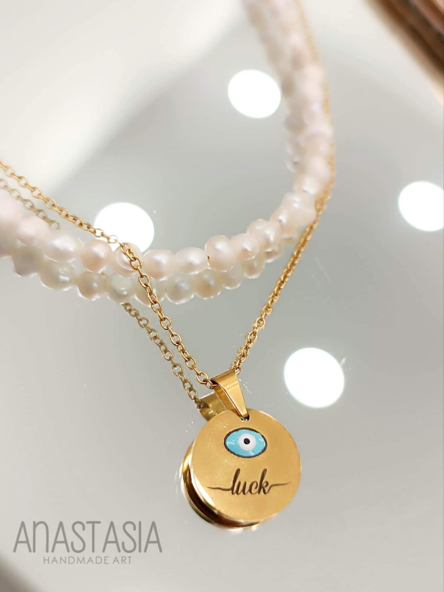 Necklace with evil eye-luck charm