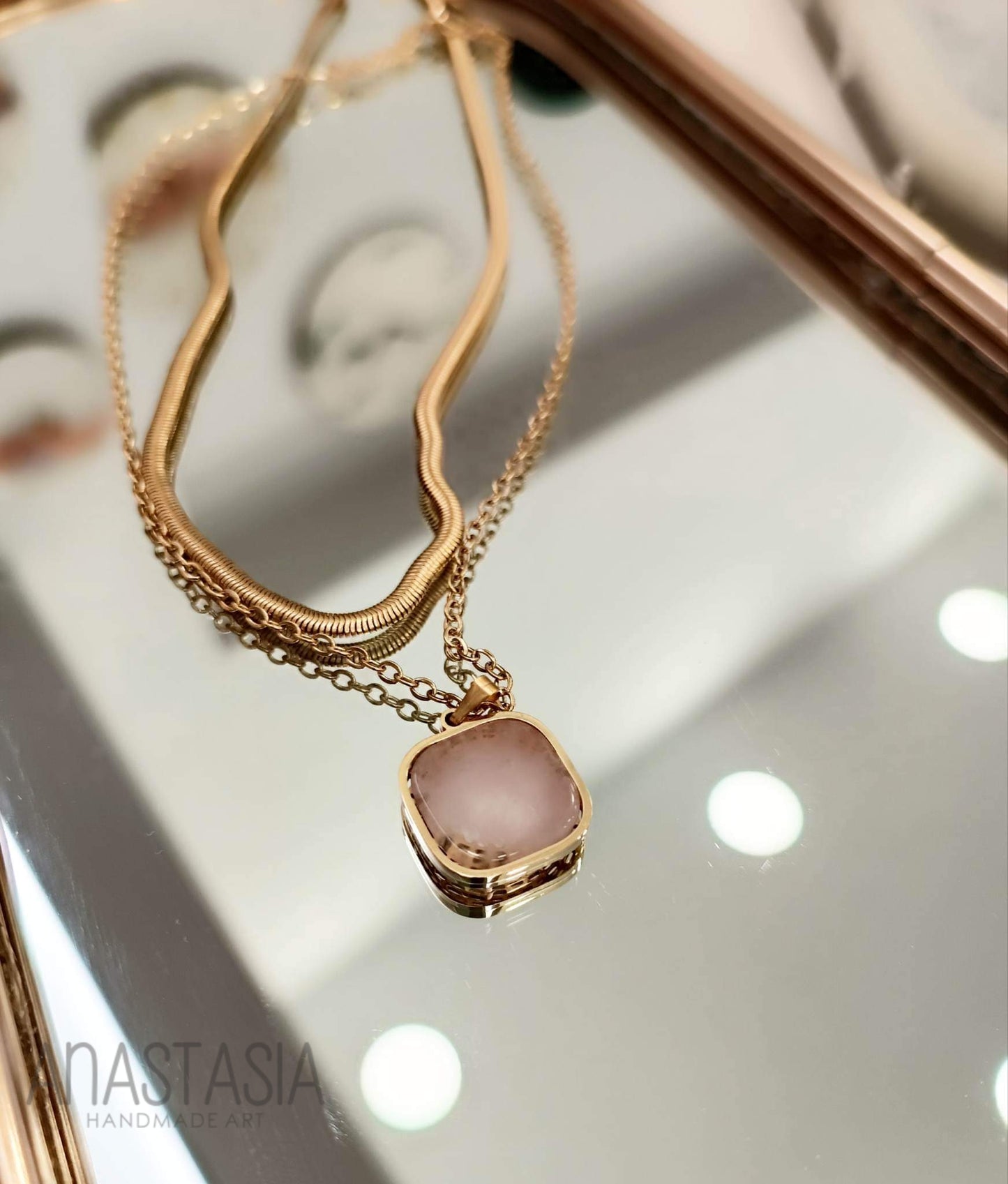Necklace with rose quartz stone charm