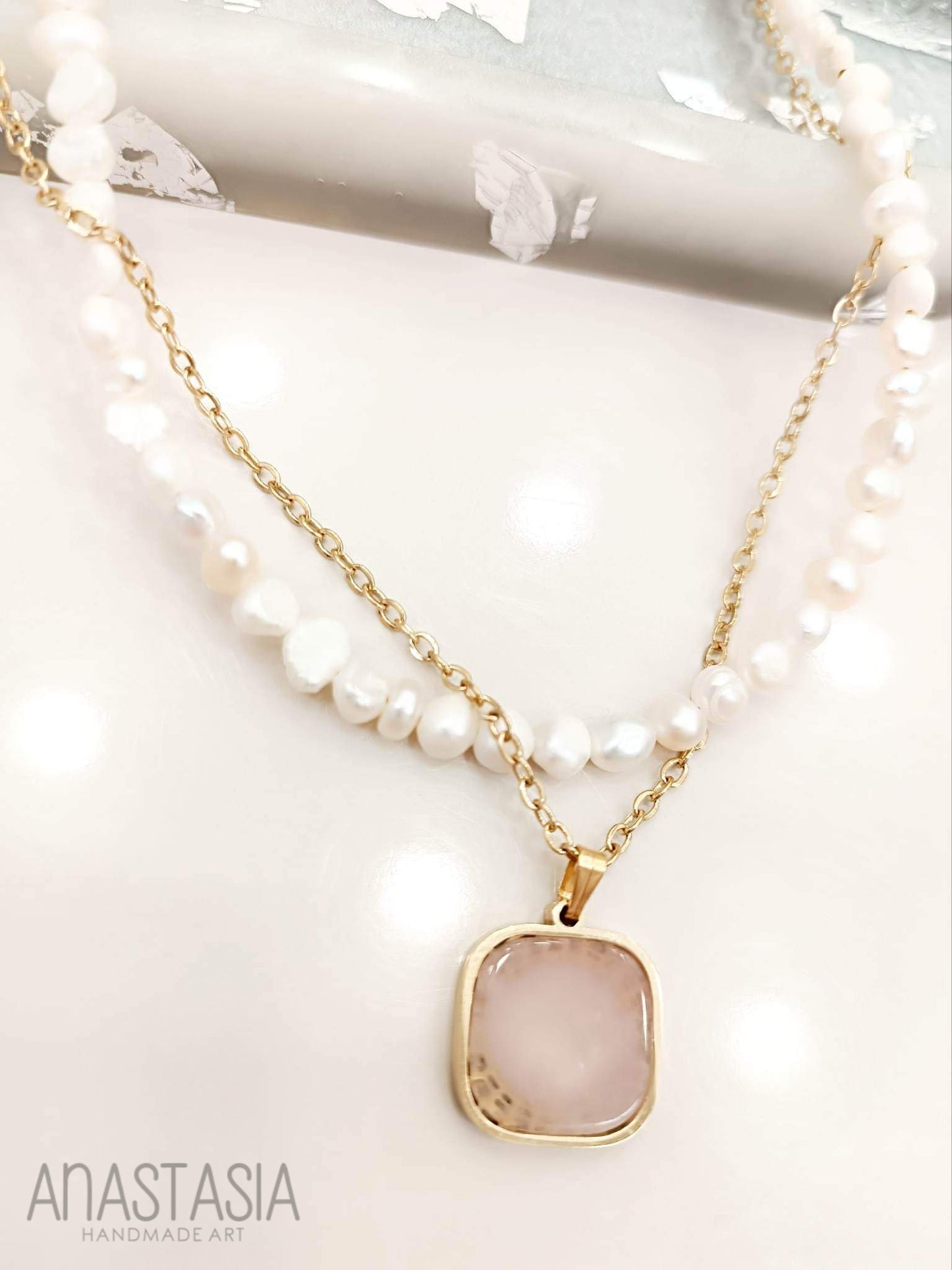 Necklace with rose quartz stone charm