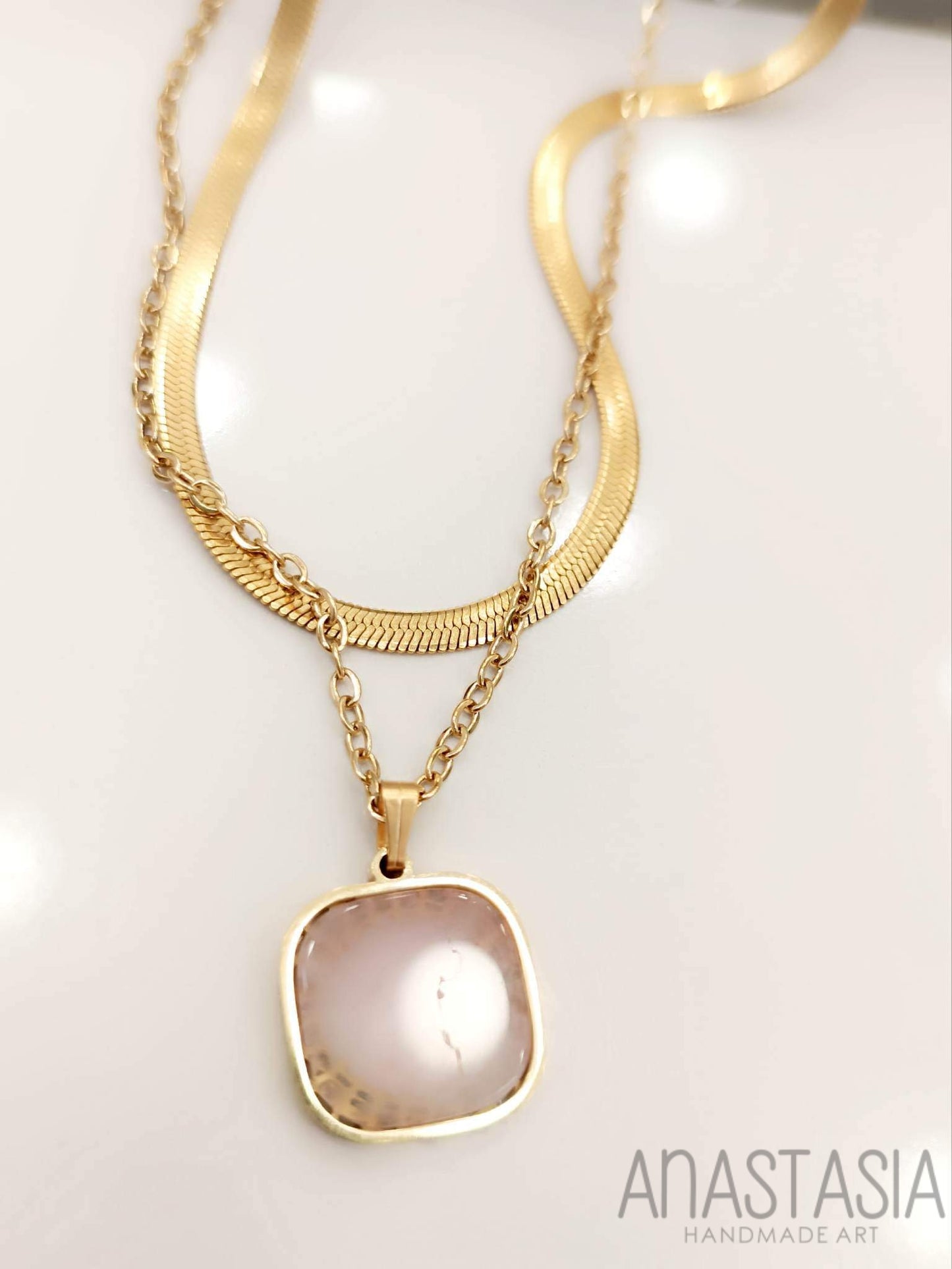 Necklace with rose quartz stone charm