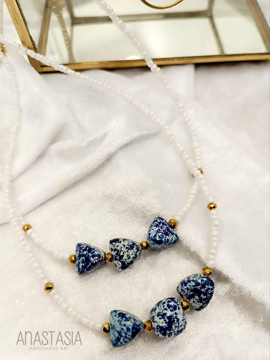 Necklace with white blue stone charm